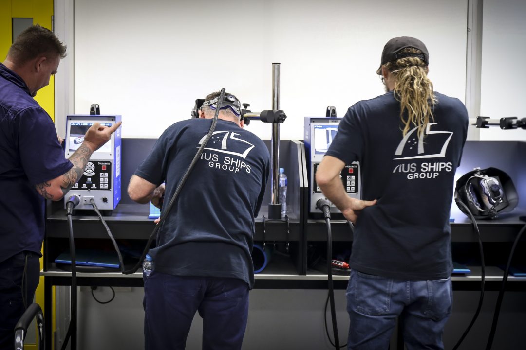 people learning to weld