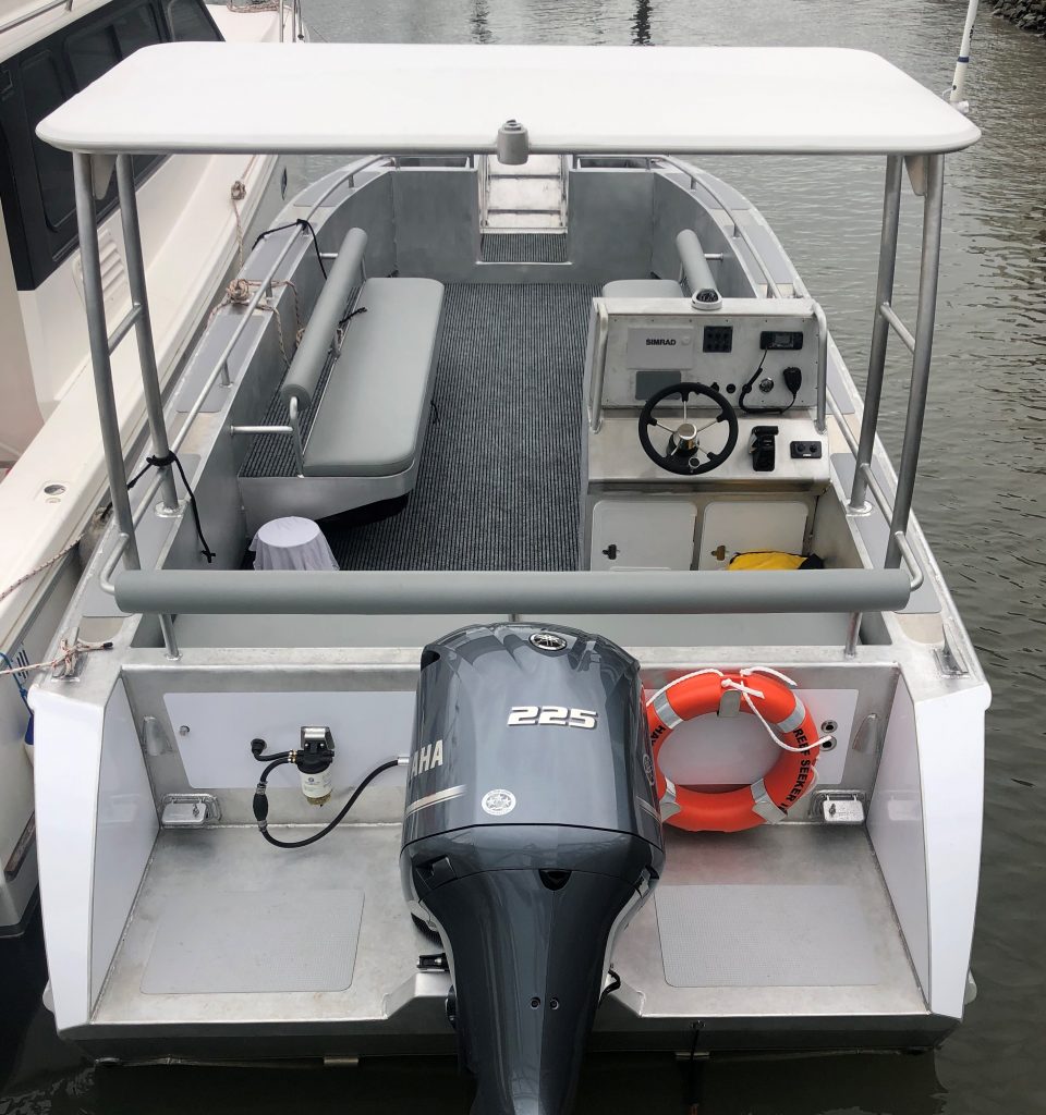 passenger transfer boat alongside dock