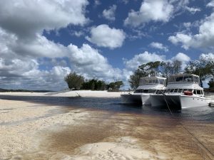 two scimitar 1010 power catamarans anchored in warthumba creek on fraser island
