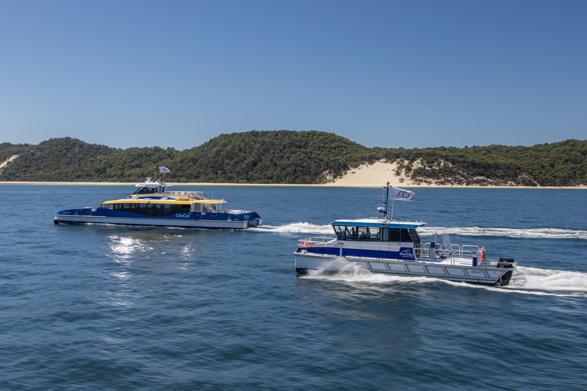 citycat and nereus workboat in moreton bay