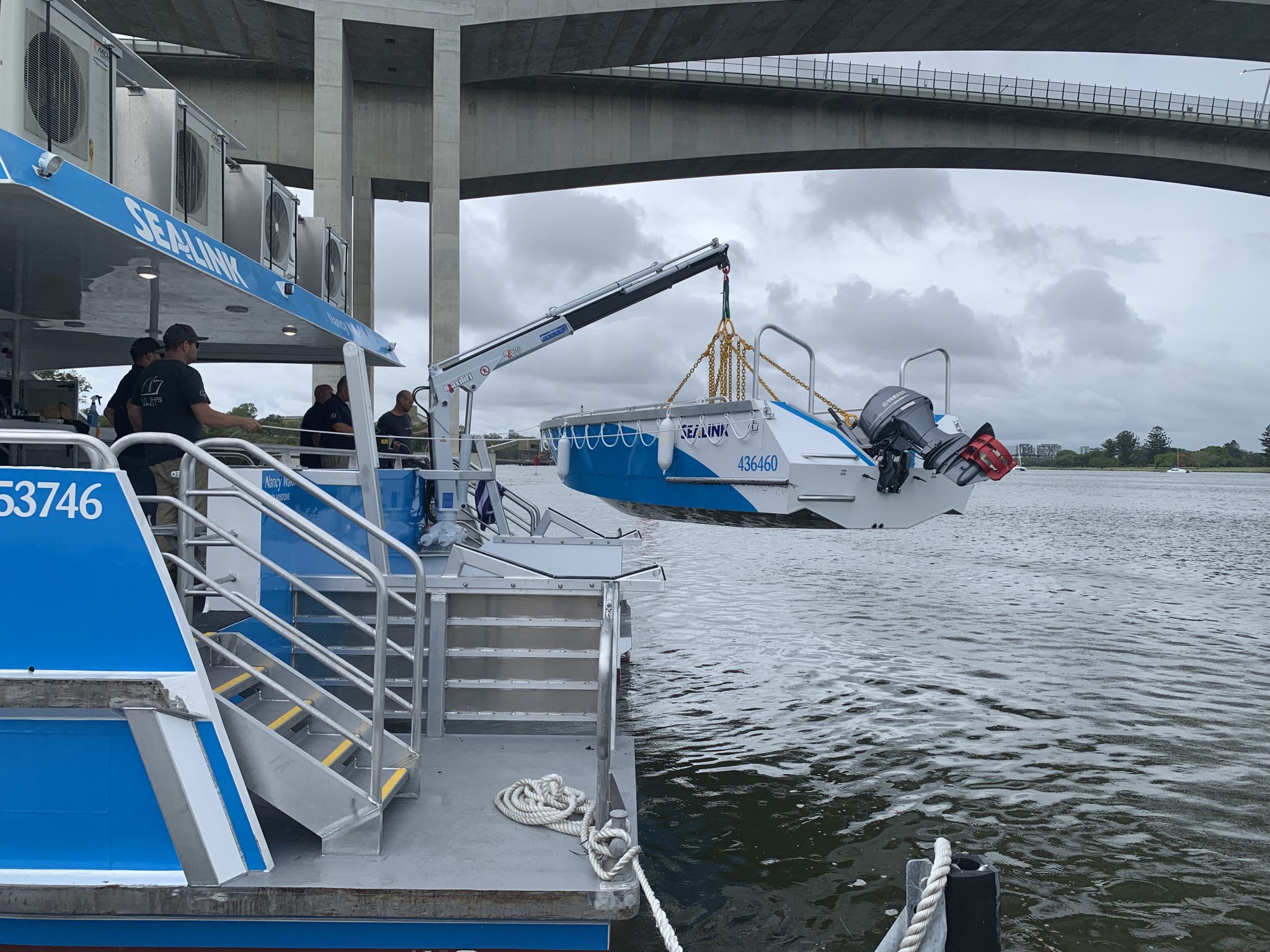 boat tender being lifted by a crane